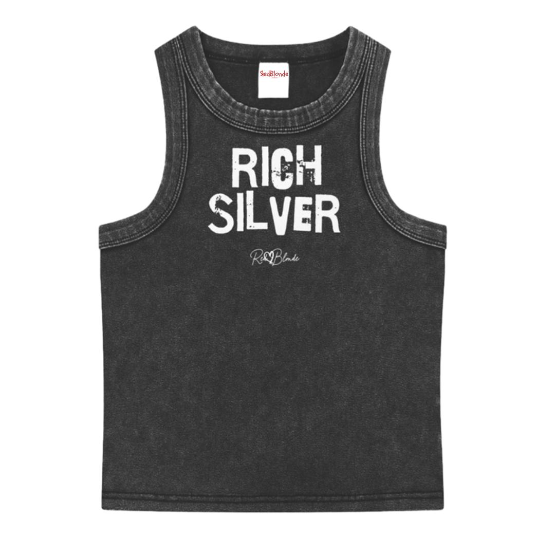 Black acid-wash vintage tank top with bold white Ed Gein font “RICH SILVER" slogan on the front and RedBlonde logo beneath.