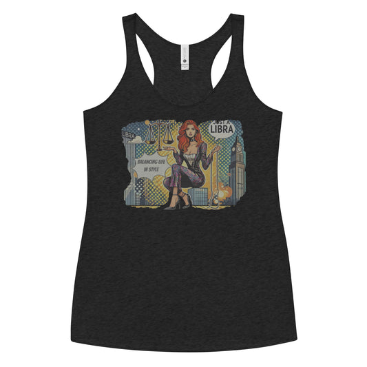 Flatlay of a heather black soft racerback tank t-shirt with a retro pop-art Libra graphic featuring a redhead woman, scales, and a city backdrop, captioned ‘Just a Libra, Balancing Life in Style’.