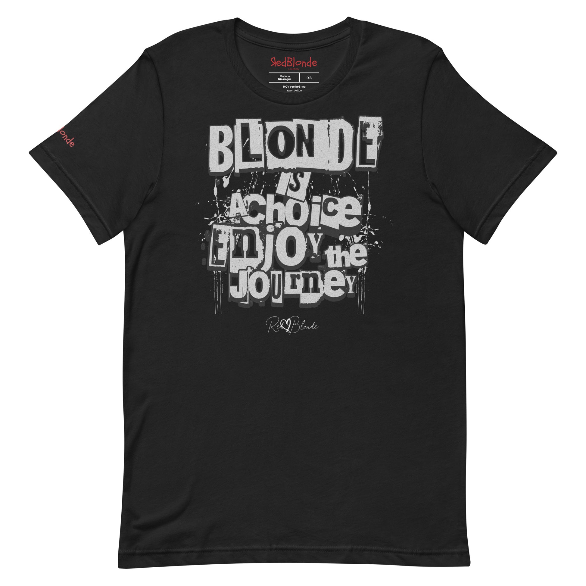 A black unisex T-shirt with a classic crew neckline and short sleeves. The front displays a bold, graffiti-style text design in black, white, and gray. The words read: “BLONDE is a choice, ENJOY the JOURNEY” with varied fonts and a layered street-art effect. The RedBlonde brand name is subtly printed below in a handwritten script. Branded RedBlonde london in red on inside neck and right sleeve