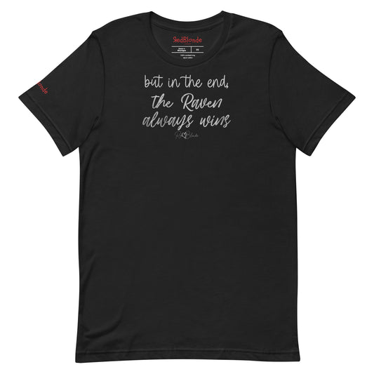A black unisex t-shirt featuring the handwritten-style slogan “but in the end, the Raven always wins” in Hillbear font  in light gray text across the chest, signed off RedBlonde. Branded “RedBlonde London on inside the collar and on the right sleeve