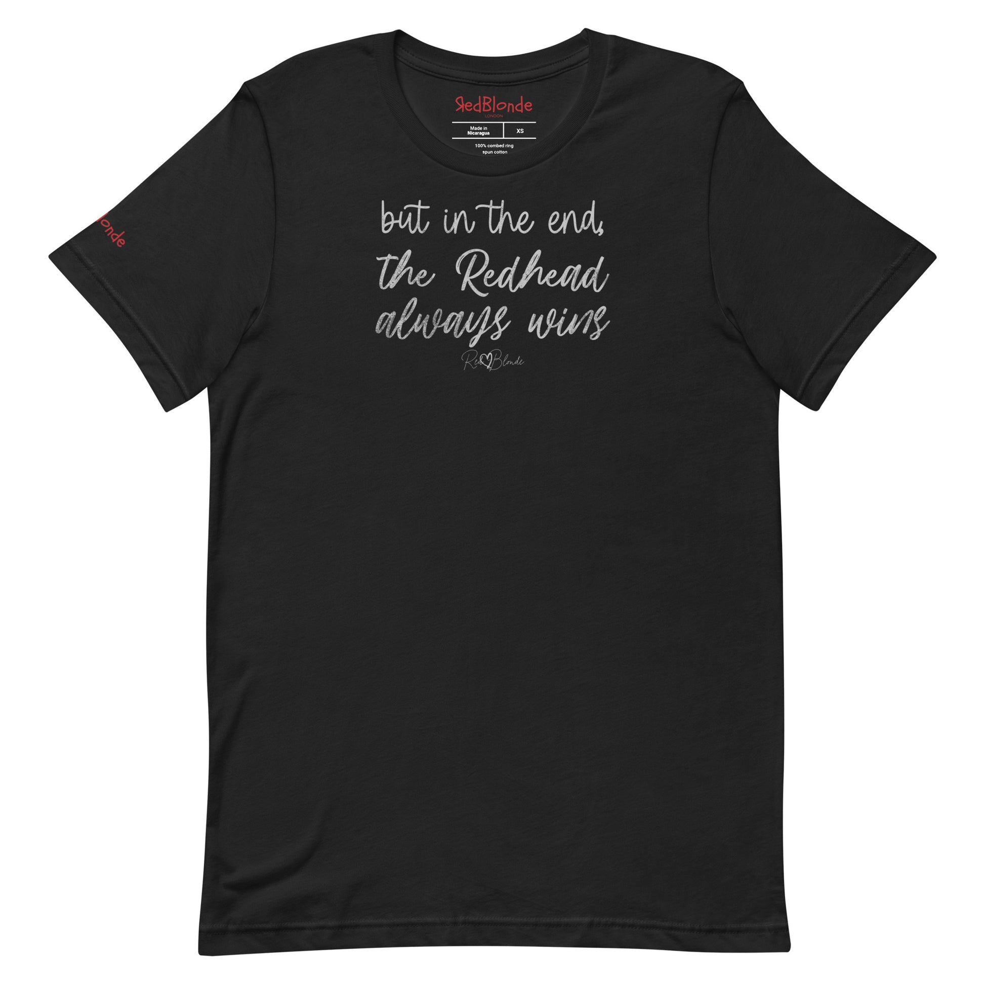 A black unisex t-shirt featuring the handwritten-style slogan “but in the end, the Redhead always wins” in Hillbear font  in dark gray text across the chest, signed off RedBlonde. Branded “RedBlonde London on inside the collar and on the right sleeve