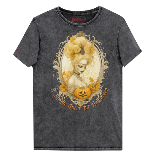Black acid-wash unisex T-shirt featuring a gothic-style illustration of blonde-haired woman with an elaborate beehive hairstyle, framed by ornate scrollwork, autumn leaves, and a carved pumpkin. The design is captioned with the text ‘A Blonde Queen for Halloween’ in vintage Dark Angle lettering. Branded RedBlonde in red on inside neck and right sleeve