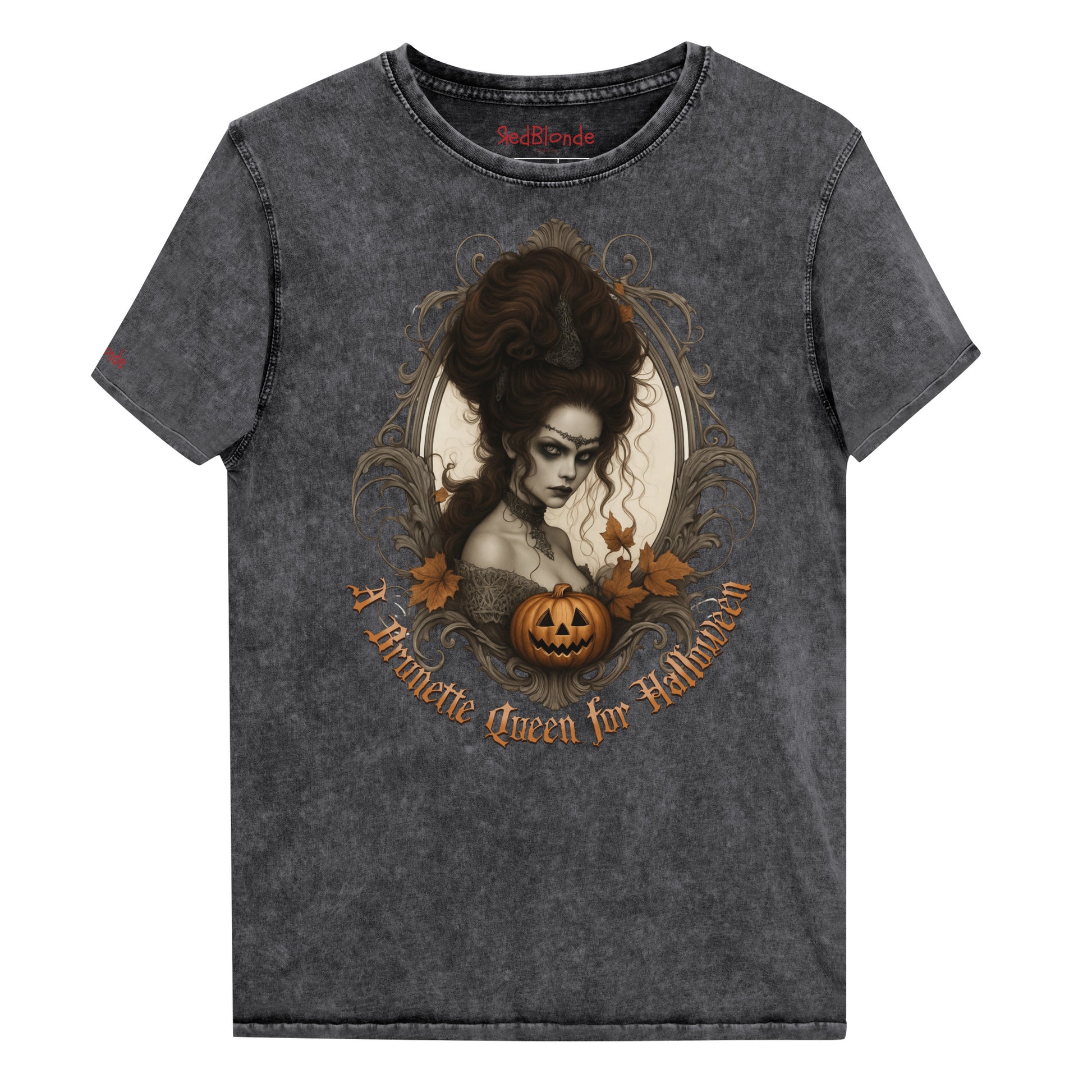 black acid-wash unisex T-shirt featuring a gothic-style illustration of a dark-haired woman with an elaborate beehive hairstyle, framed by ornate scrollwork, autumn leaves, and a carved pumpkin. The design is captioned with the text ‘A Brunette Queen for Halloween’ in vintage Dark Angle lettering. Branded RedBlonde in red on inside neck and right sleeve