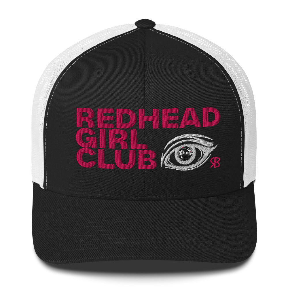 black/white mesh trucker hat featuring bold red embroidered text “Redhead Girl Club” alongside a detailed embroidered eye graphic and a small red RB logo.