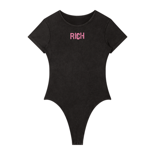 Washed charcoal ribbed short sleeve bodysuit with a crew neckline and pink 'RICH'  in Ed Gein font graphic at the chest.