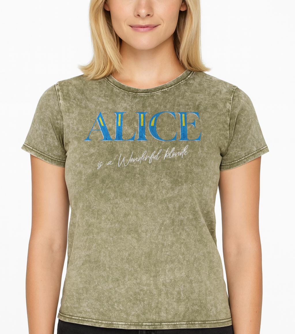 Blonde wears a Dark army green acid-wash unisex T-shirt with bold blue Glook text “ALICE” across the chest. Beneath it, in elegant white script, it reads “is a Wonderful Blonde.” The inside neck and sleeve also feature the RedBlonde logo in red.