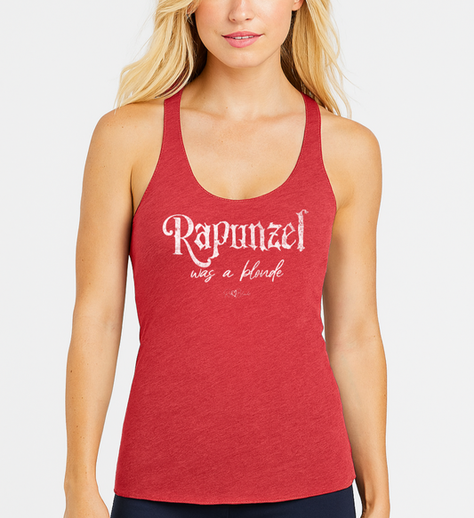blonde wears a red women’s racerback tank featuring white fairytale spiky text that reads “Rapunzel" and the phrase “was a blonde” written underneath in an elegant cursive script. signed off with the RedBlonde heart signature logo