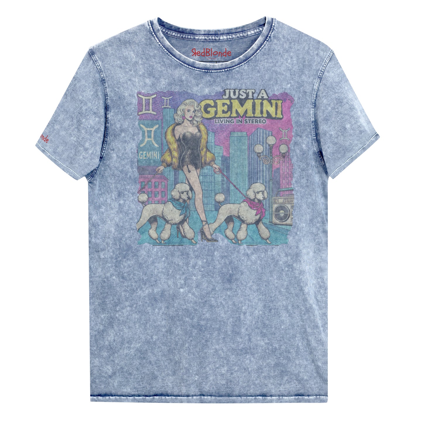 Flatlay of a unisex blue denim wash vintage t-shirt with a retro pop-art Gemini graphic featuring a blonde woman, in a short catsuit and fur coat walking two poodle dogs with neck scarfs with a city backdrop and a gettoblaster ‘Just a Gemini, Living in Stereo'. Branded RedBlonde on inside neck and right shoulder