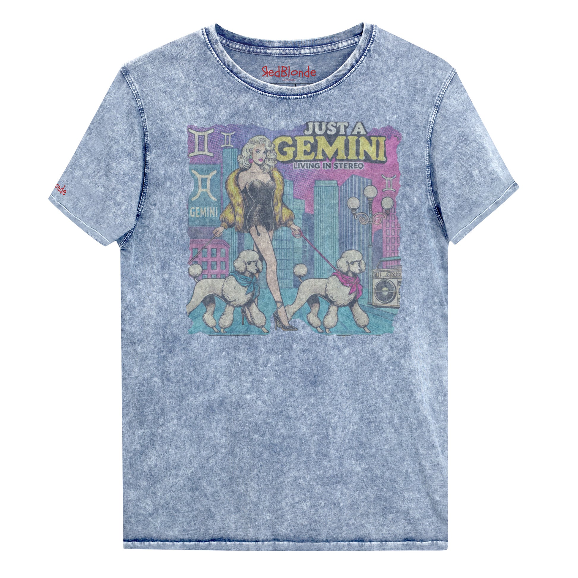 Flatlay of a unisex blue denim wash vintage t-shirt with a retro pop-art Gemini graphic featuring a blonde woman, in a short catsuit and fur coat walking two poodle dogs with neck scarfs with a city backdrop and a gettoblaster ‘Just a Gemini, Living in Stereo'. Branded RedBlonde on inside neck and right shoulder