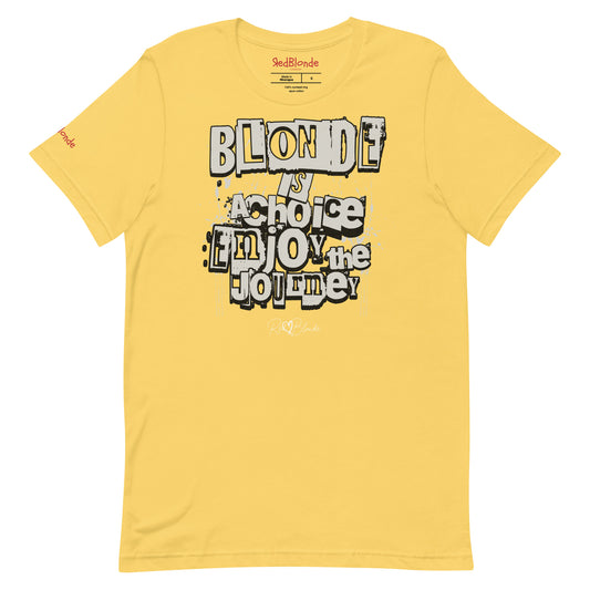 A bright yellow unisex T-shirt with a classic crew neckline and short sleeves. The front displays a bold, graffiti-style text design in black, white, and gray. The words read: “BLONDE is a choice, ENJOY the JOURNEY” with varied fonts and a layered street-art effect. The RedBlonde brand name is subtly printed below in a handwritten script. Branded RedBlonde london in red on inside neck and right sleeve
