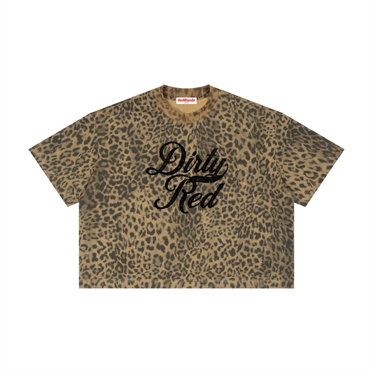 brown/green oversized T-shirt with an all-over animal print, ribbed crew neckline, and faded black Dirty Red Milkstore script graphic across the front.