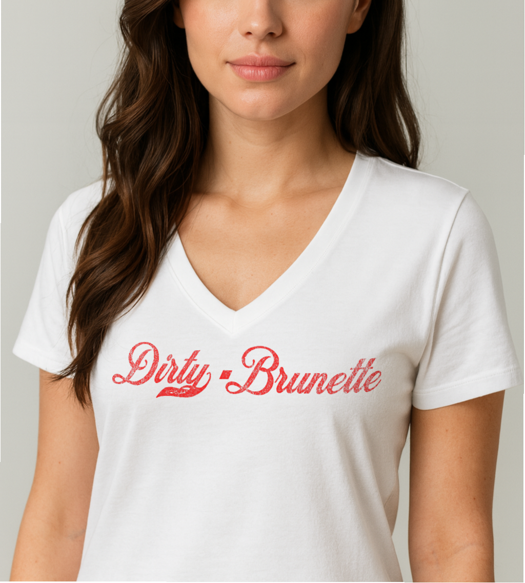 brunette wears a white relaxed fit V-neck t-shirt with “Dirty Brunette” written in vintage Coca-Cola red script on the front. Branded RedBlonde on inside neck and right shoulder in red