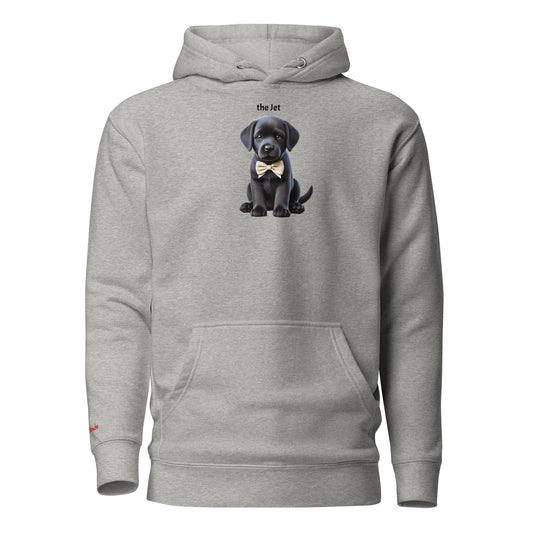 Flatlay of carbon grey relaxed fit unisex hoodie with a cute graphic of a Jet black puppy wearing a bow-tie and the words 'the Jet' linking to Black hair. Branded RedBlonde in red on inside neck and right cuff