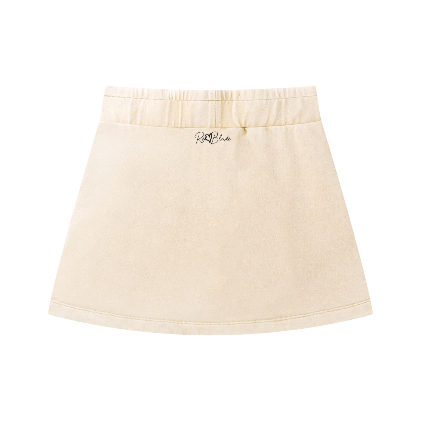 Back view of a cream mineral-wash mini skirt with a mid-rise elastic waistband, subtle A-line/H-line shape, and side slash pockets. Featuring the RedBlonde signature logo
