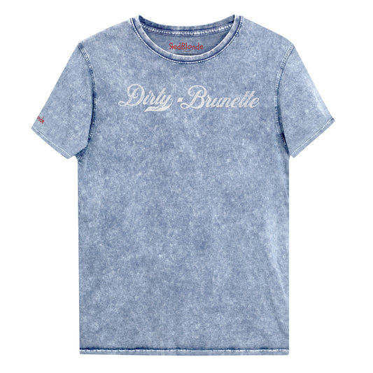 Flatlay of a blue unisex loose-fit denim wash t-shirt with vintage Coca-Cola-inspired milkstore script in white reading ‘Dirty Brunette’ on the front. Branded RedBlonde on the inside neck and right shoulder in red