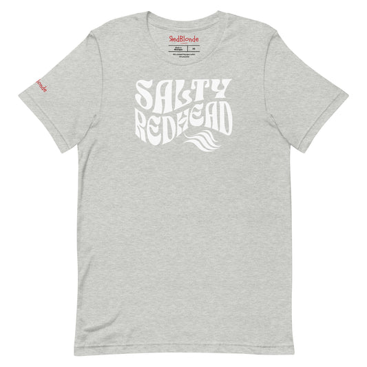 flatlay of gray classic unisex graphic t-shirt with the slogan 'Salty Redhead' in Solino Display blue retro 70s wavy font. Branded RedBlonde in red on inside neck and right sleeve
