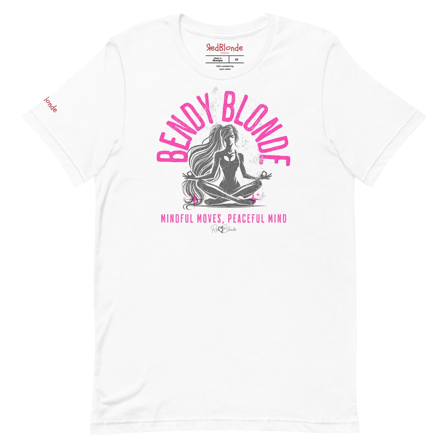 flatlay of white unisex graphic slogan t-shirt with 'BENDY BLONDE' in bright pink Adventurer06 font in a semi circle above a yoga posing cross-legged sitting women with the words 'mindful moves, peaceful mind' written underneath and signed RedBlonde. Branded RedBlonde London in red on inside neck and right sleeve 