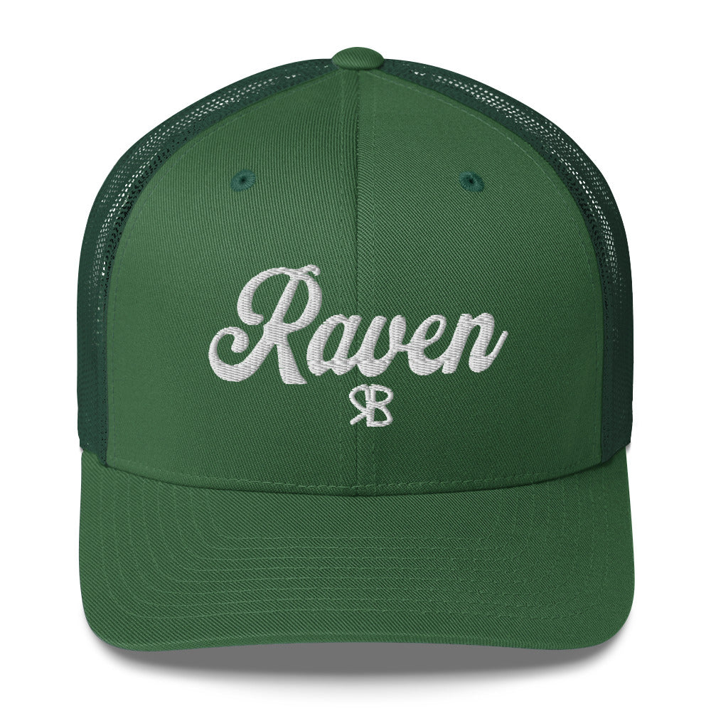 green trucker cap with 'Raven' in white adventurer 01 font on front. Branded RB