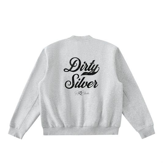 The back of a grey crew neck zip up varsity jacket  laid flat on a white background. It has ribbed cuffs, collar, and hem. Large black Milkstore 01 script text across the back reads “Dirty Silver,” with a small cursive RedBlonde logo beneath.