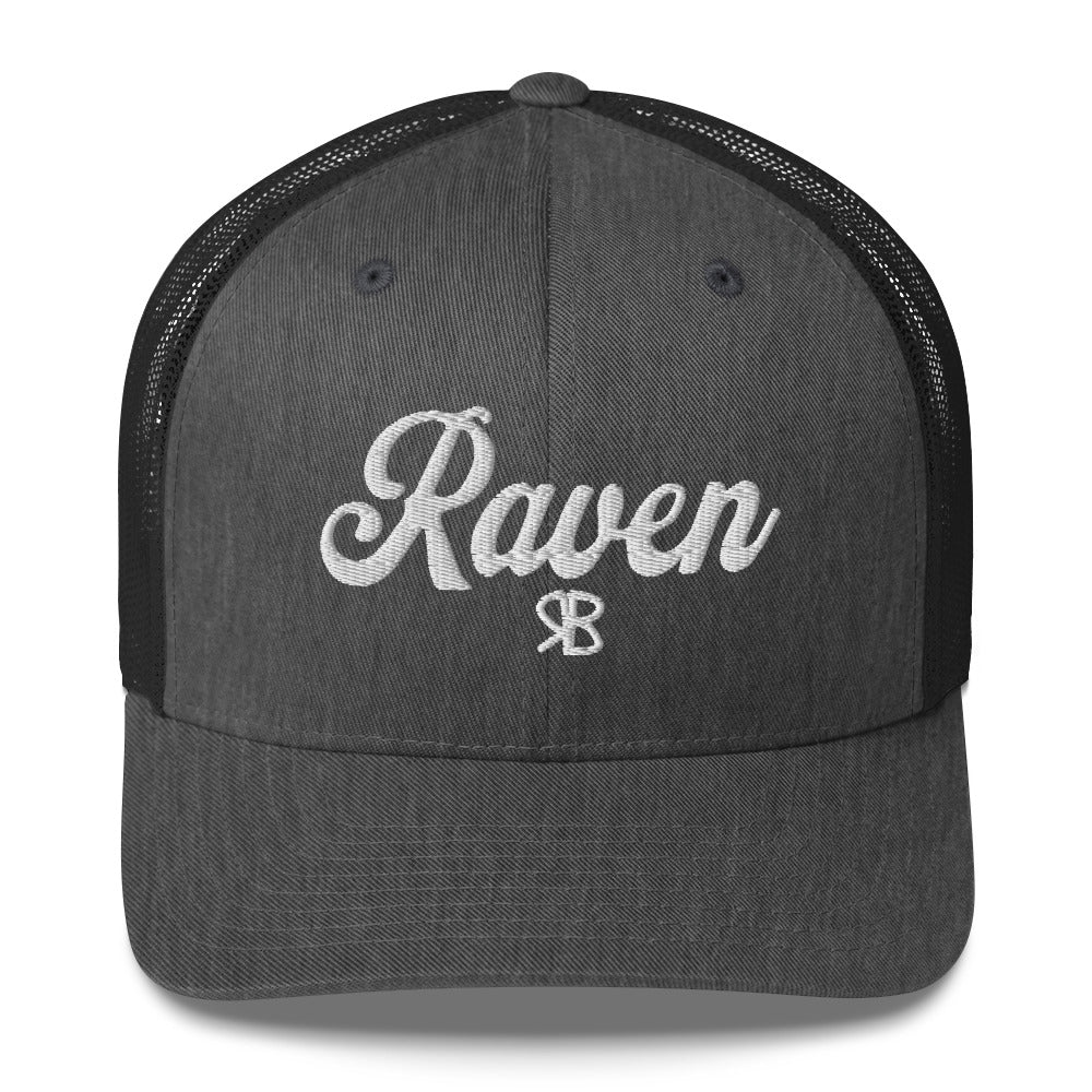 grey/black trucker cap with 'Raven' in white adventurer 01 font on front. Branded RB