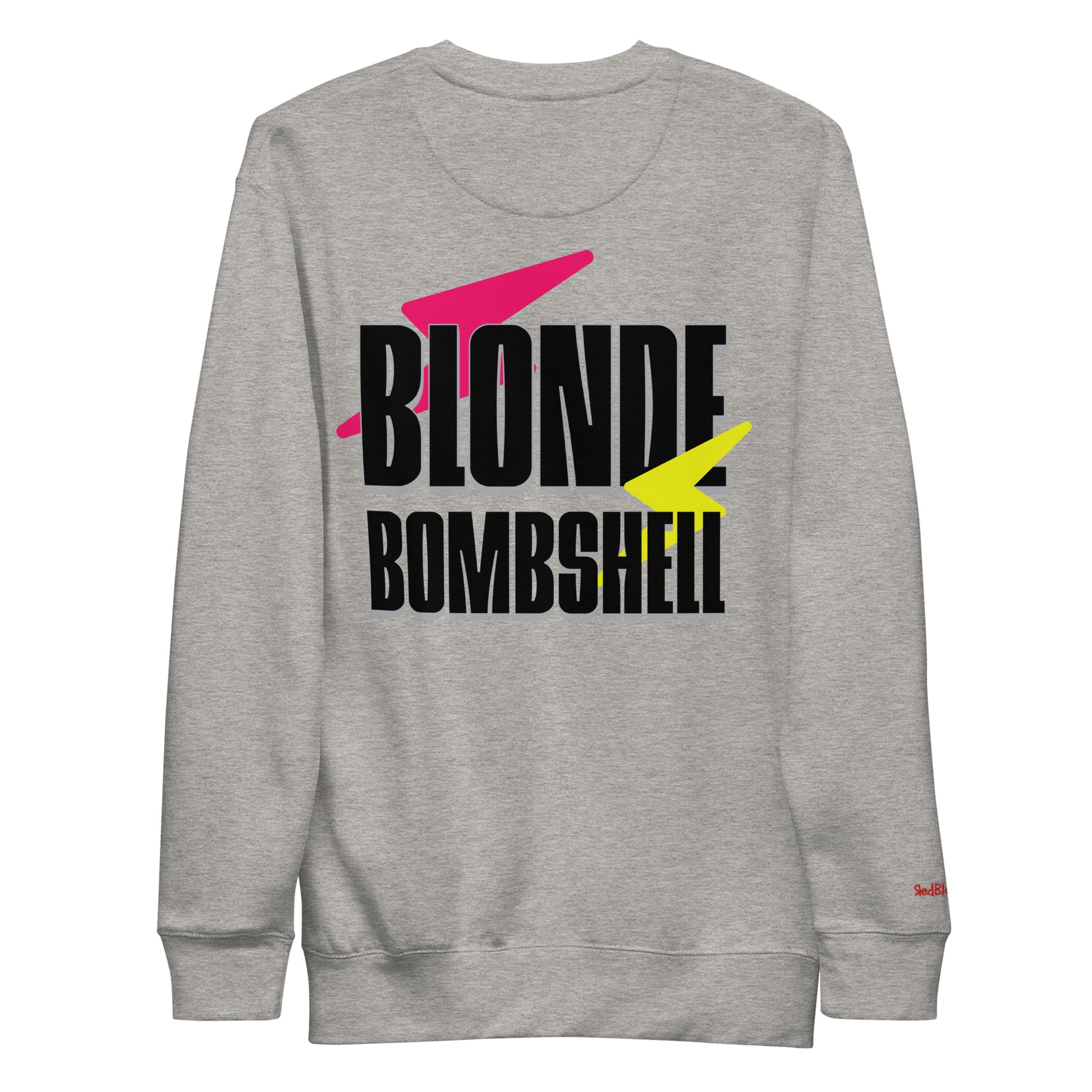 Light grey unisex sweatshirt with bold black Krisha text “BLONDE BOMBSHELL” on the back, accented by a pink lightning bolt through “BLONDE” and a yellow lightning bolt through “BOMBSHELL.”