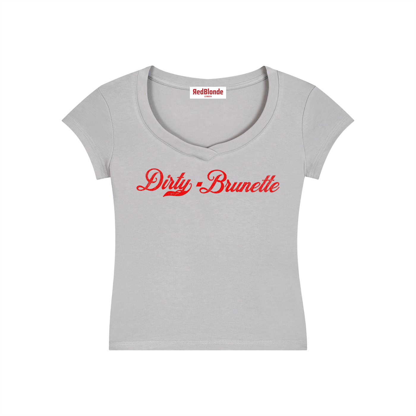 A fitted grey V-neck T-shirt laid flat on a white background. It has short sleeves and a red Milkstore 01 script graphic across the chest reading “Dirty-Brunette.” A small RedBlonde label is visible at the inside back neck.