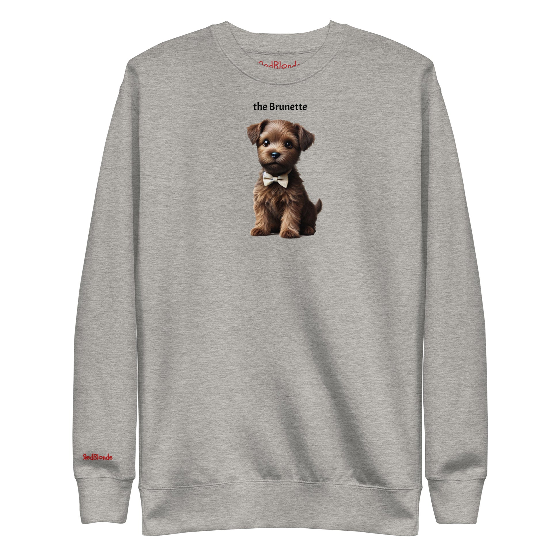 Flatlay of grey relaxed fit unisex sweatshirt with a cute graphic of a Brunette puppy wearing a bow-tie and the words 'the Brunette' linking to Brunette hair. Branded RedBlonde in red on inside neck and right cuff
