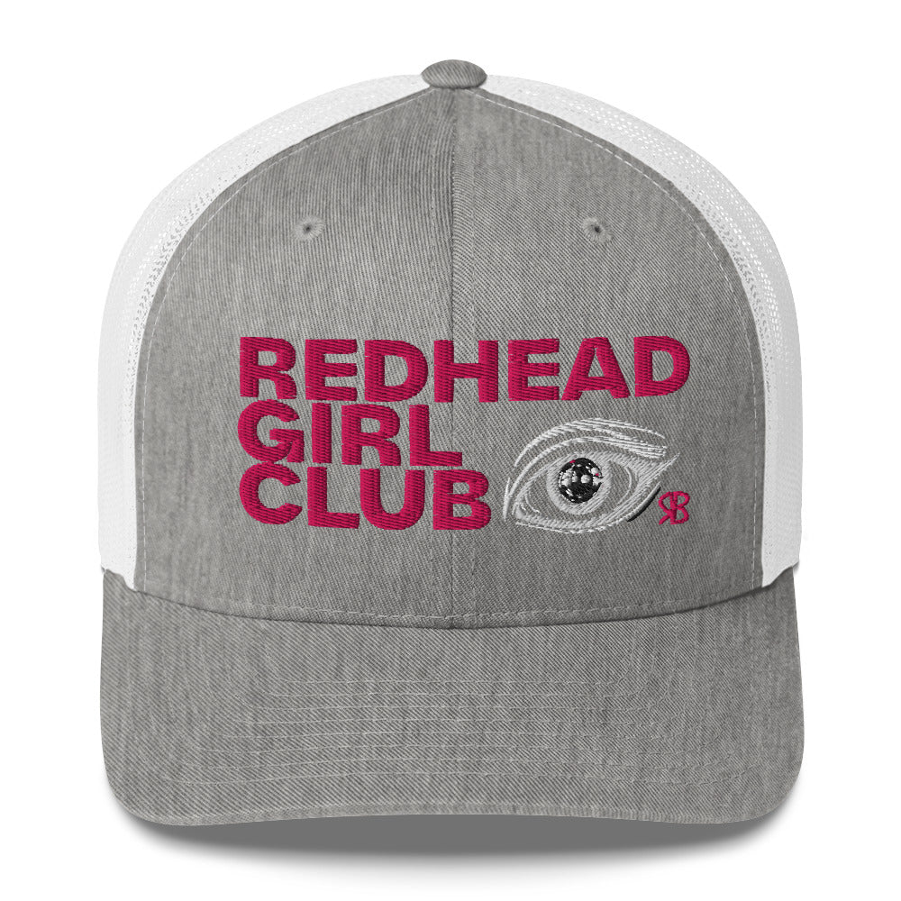 Grey/White mesh trucker hat featuring bold red embroidered text “Redhead Girl Club” alongside a detailed embroidered eye graphic and a small red RB logo.