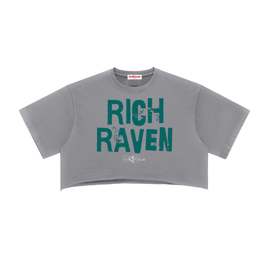 grey cropped T-shirt with oversized short sleeves and a green “RICH RAVEN” in Ed Gein font graphic on the front, plus a small RedBlonde script logo underneath.