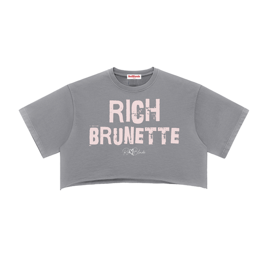 grey cropped T-shirt with oversized short sleeves and a pink tint “RICH BRUNETTE” in Ed Gein font graphic on the front, plus a small RedBlonde script logo underneath.