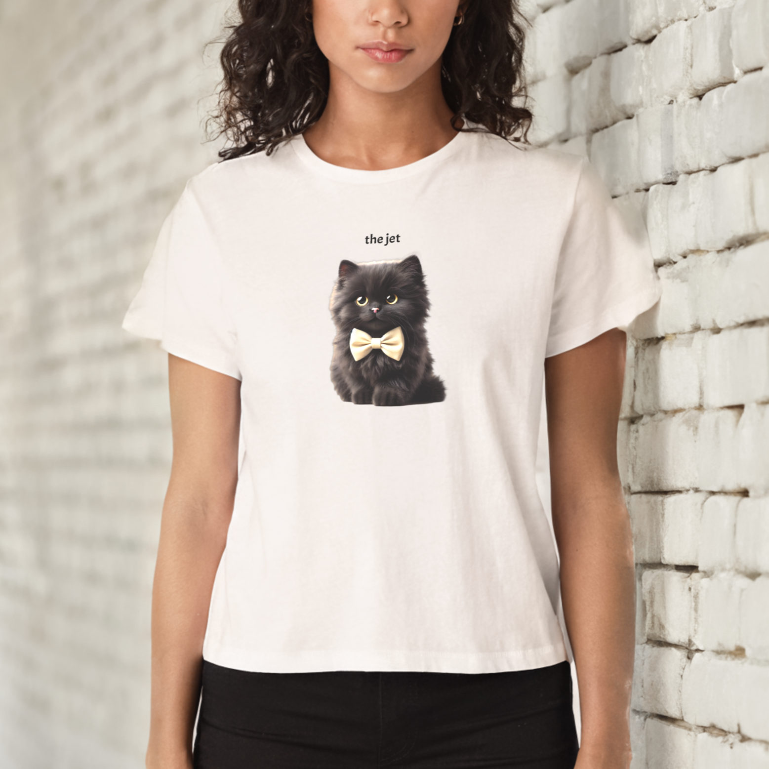 high waisted relaxed white t-shirt with cute graphic of jet black kitten wearing a bow-tie and the words 'the Jet' linking to jet black raven hair.