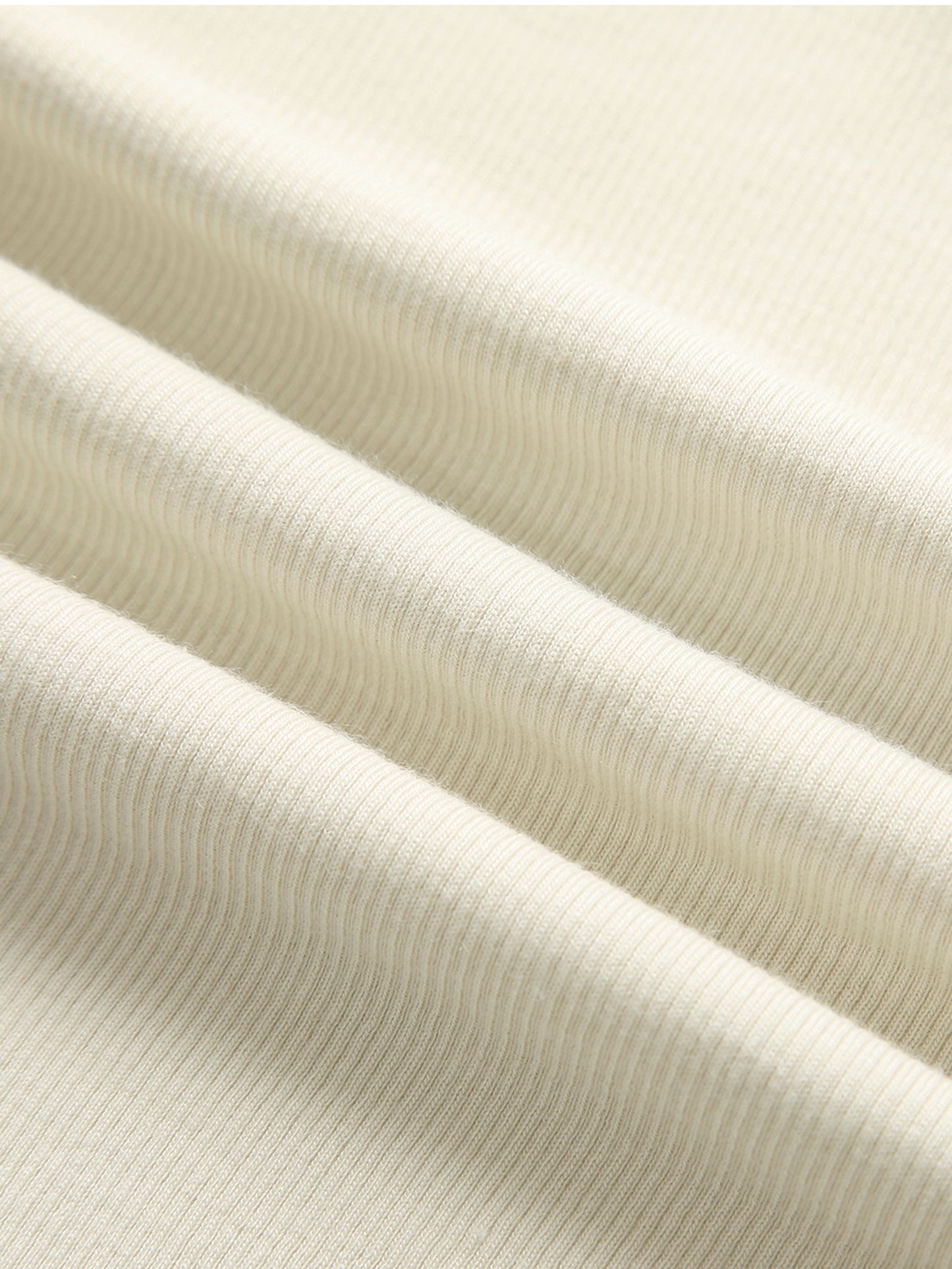 Close-up of beige ribbed fabric texture