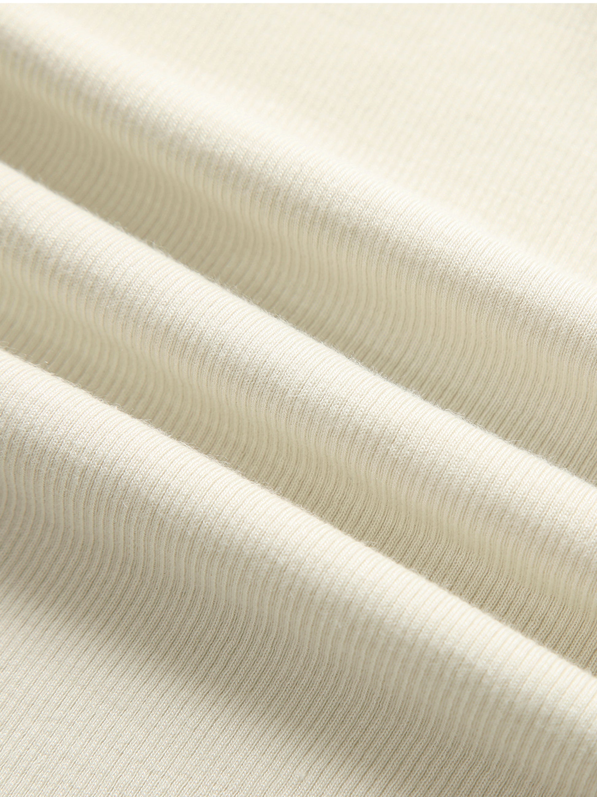 Close-up of beige ribbed fabric texture