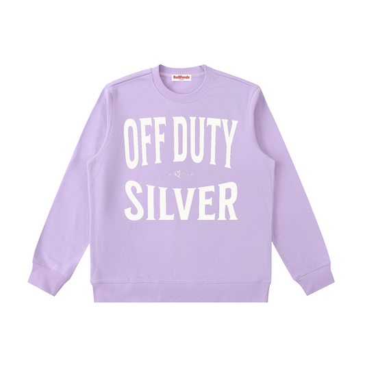 lavender crewneck sweatshirt with a large white “OFF DUTY SILVER” graphic across the chest and a small RedBlonde script logo centered between the words.