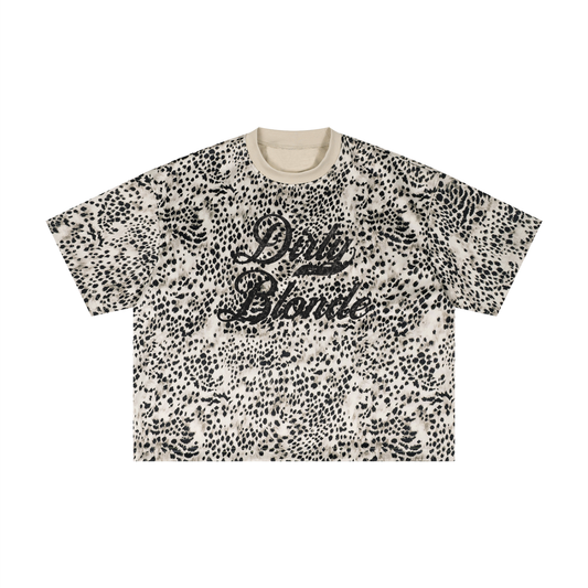 Cream oversized T-shirt with an all-over animal print, contrasting ribbed crew neckline, and faded black Dirty Blonde Milkstore script graphic across the front.
