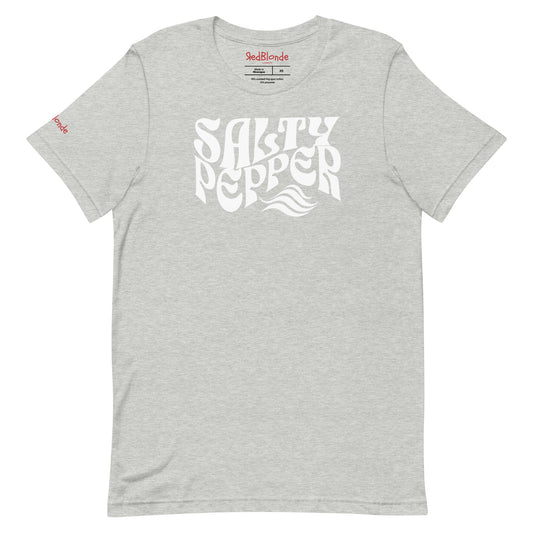 flatlay of light gray classic unisex graphic t-shirt with the slogan 'Salty Pepper' in Solino Display white retro 70s wavy font. Branded RedBlonde in red on inside neck and right sleeve