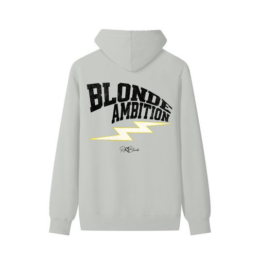 Light grey hoodie featuring bold white vintage-textured TRICOT font lettering that reads “Blonde Ambition” across the back, with a yellow lightning bolt graphic underneath and the RedBlonde signature logo printed below.