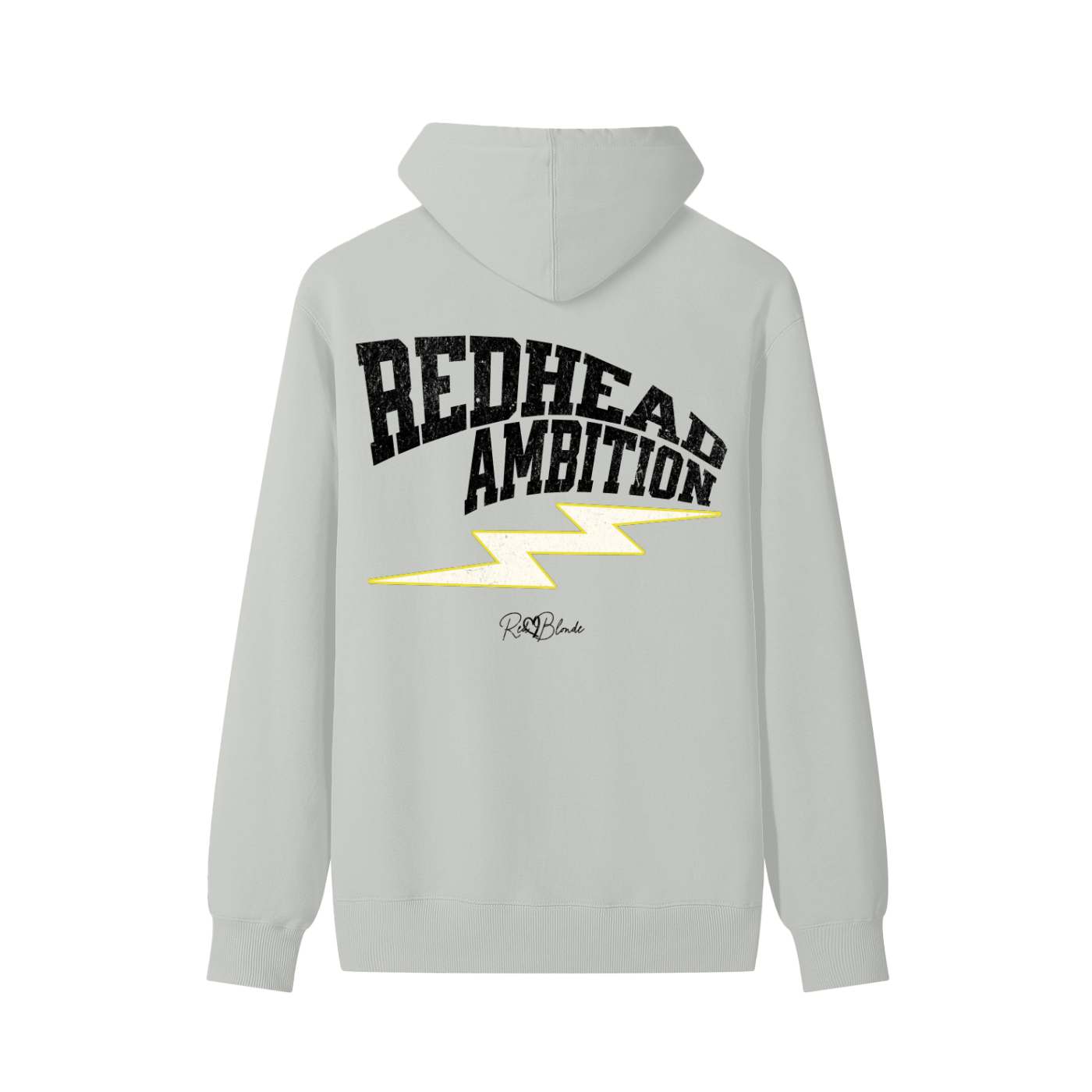 light grey hoodie featuring bold white vintage-textured TRICOT font lettering that reads “Redhead Ambition” across the back, with a yellow lightning bolt graphic underneath and the RedBlonde signature logo printed below.