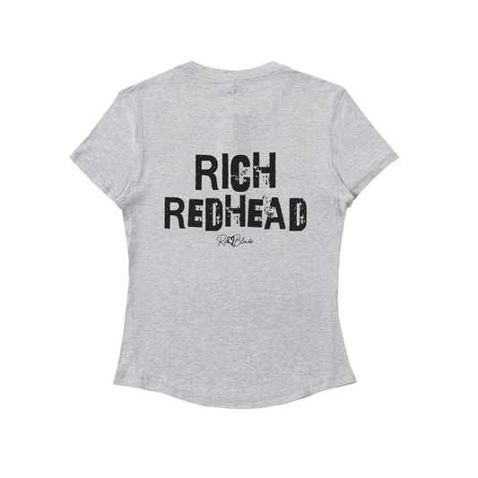 Back view of a light grey slightly fitted women’s henley T-shirt with short sleeves and a gently curved hem. Centered on the upper back is bold distressed black Ed Gein text reading “RICH REDHEAD” with a small RedBlonde signature script logo beneath it. The shirt is shown on a plain white background.