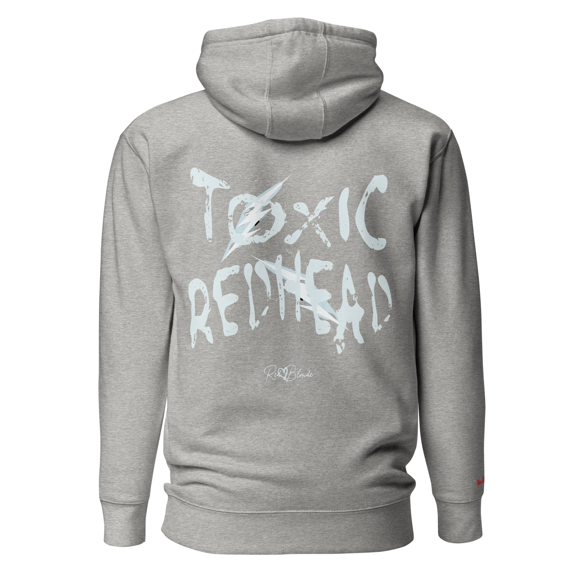 Back view of a light grey unisex hoodie featuring bold distressed white Chainsaw Carnage text reading “Toxic Redhead” with lightning-style accents and the RedBlonde signature logo underneath. The design has an edgy, electric aesthetic.It features the text 'Blonde' embroidered on the front. Branded RedBlonde in red on right sleeve.