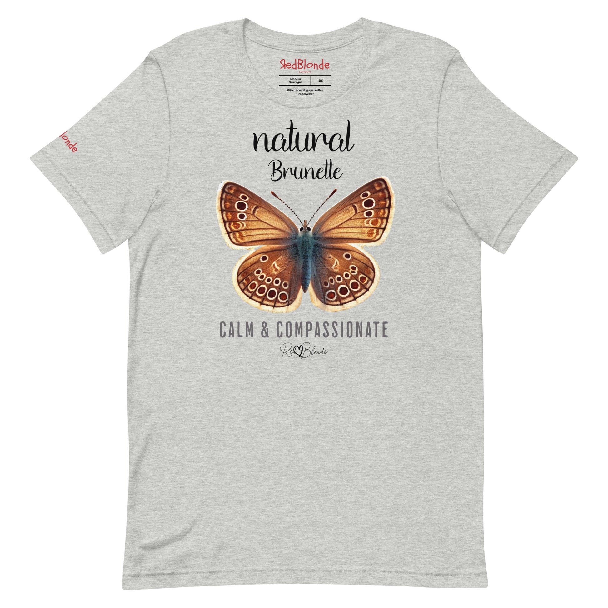Flatlay of light grey unisex relaxed fit t-shirt with the words natural brunette in arionna font above a graphic of a brunette brown butterfly with 'CALM & COMPASSIONATE' below in  adventurer 06 font signed off by RedBlonde. Branded RedBlonde London on inside neck and right sleeve