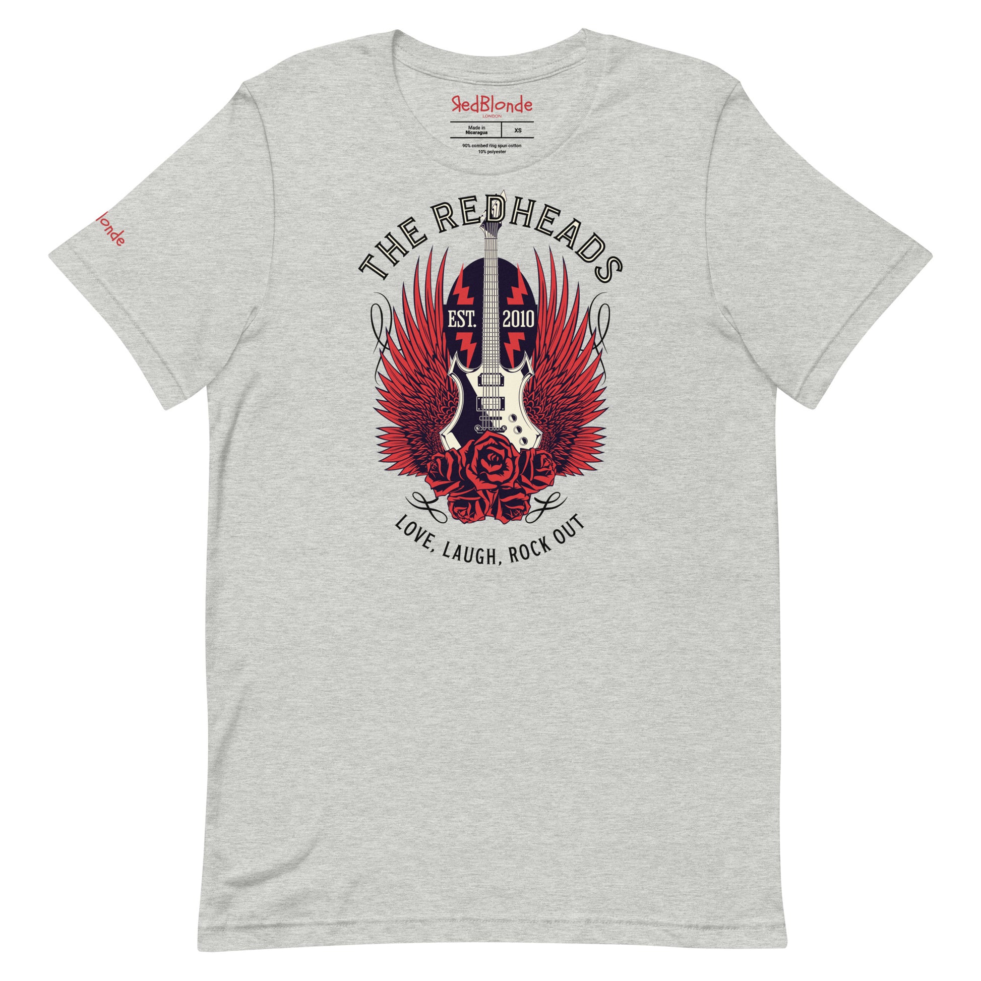 A flatlay of a light grey unisex t-shirt with a graphic of a black & white guitar with red bird wings emerging from the side. The graphic features ‘THE REDHEADS' in Brookfield font in a semicircle above the guitar, while ‘Love, laugh, rock out’ is underneath. Branded RedBlonde London in inside neck and right sleeve