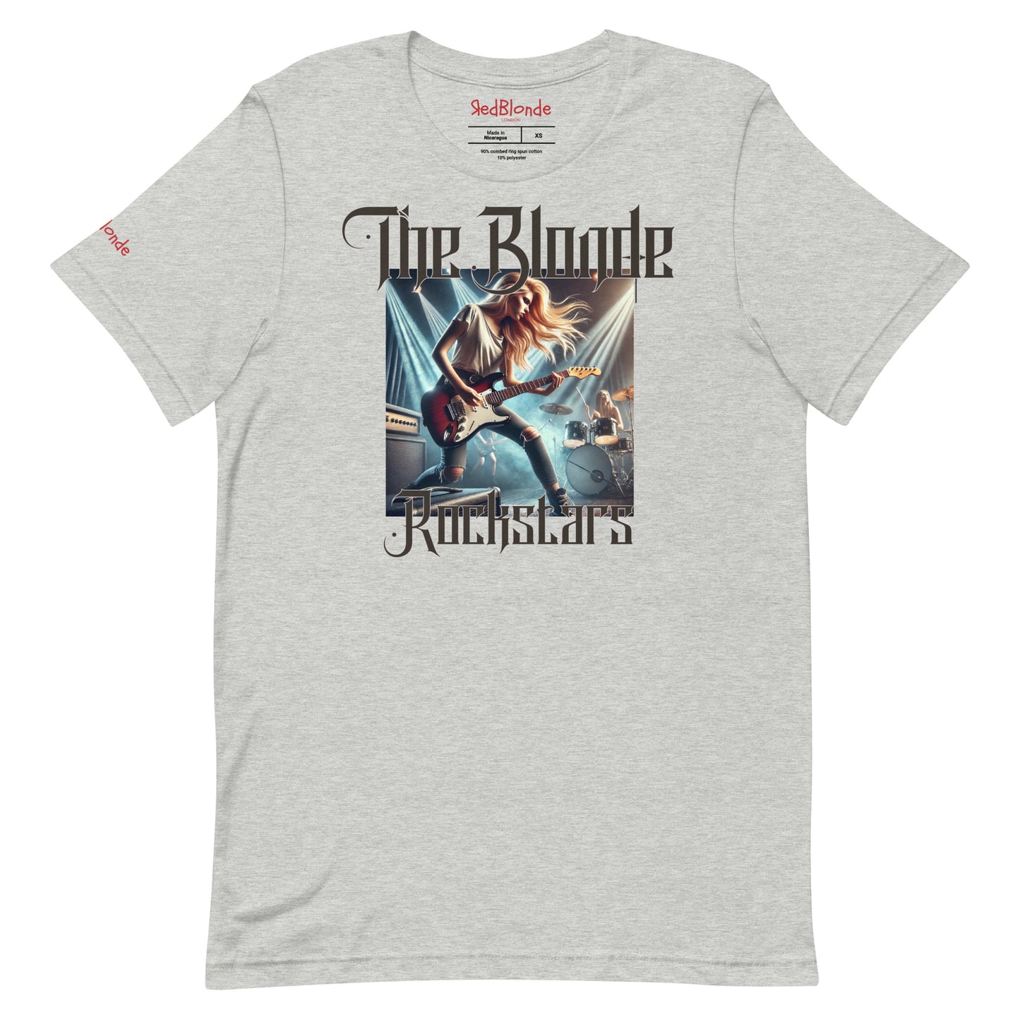 A light grey unisex t-shirt with a graphic of a blonde female rock guitarist on stage with a drummer in the background, illuminated by stage lights. The text ‘The Blonde Rockstars’ is in bold, metallic avalen rekas font above and below the image. Branded RedBlonde London in red on the inside neck and right sleeve.
