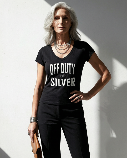 model wears a black fitted V-neck T-shirt with black ‘OFF DUTY SILVER’ Brookfield text front print, RedBlonde logo detail, and RedBlonde neck label