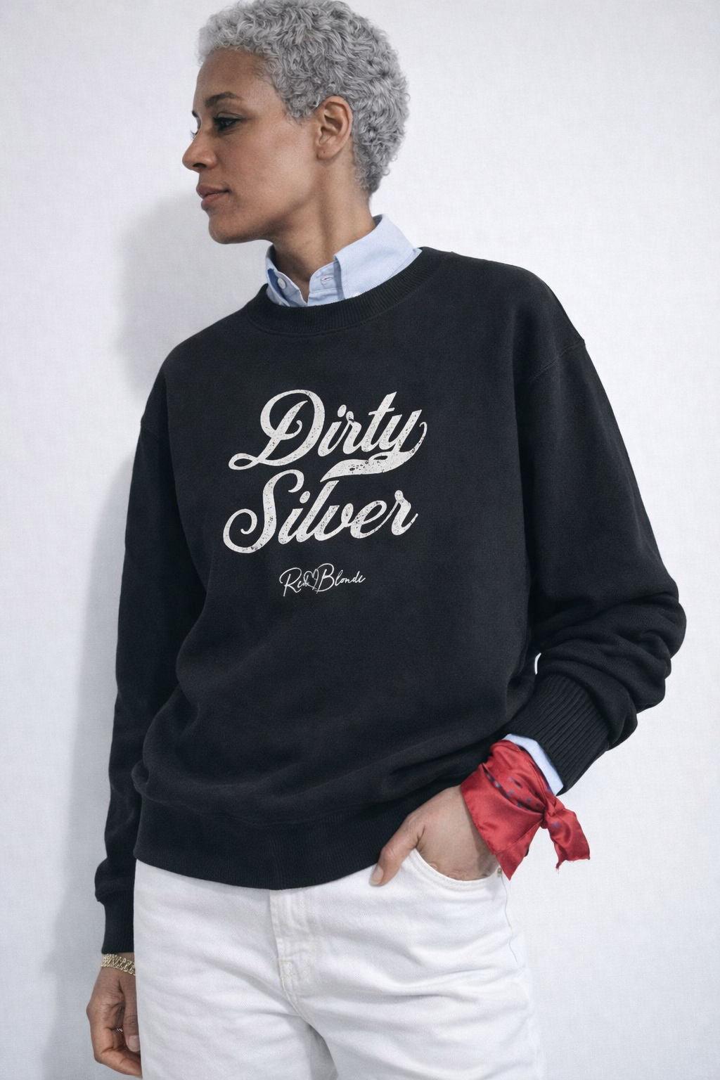 model wears black Classic relaxed fit premium unisex sweatshirt with the playful slogan ‘Dirty Silver’ in white milk-store font, signed off RedBlonde. 