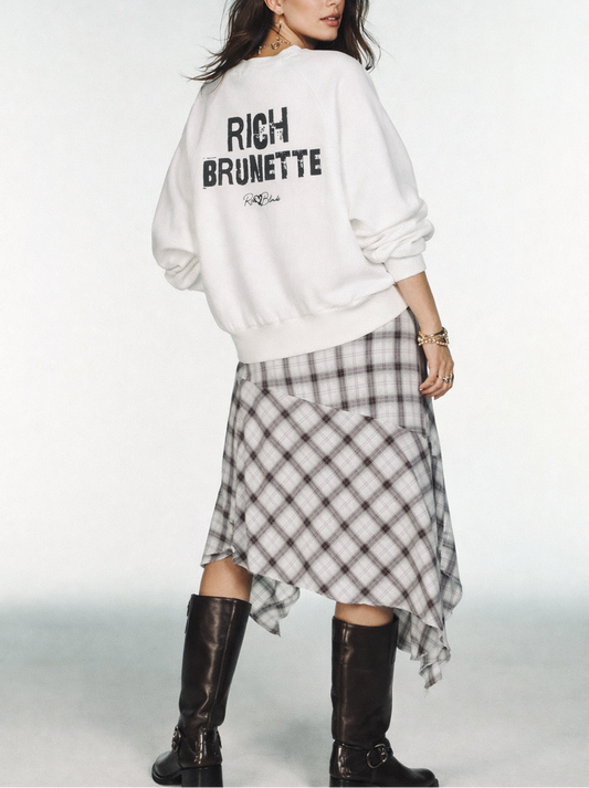 model wears oversized dolman-sleeve sweatshirt shown from the back. It has a boxy, relaxed fit with dropped shoulders, ribbed crew neckline, ribbed cuffs, and a ribbed hem band. Centered on the back is a distressed black “RICH BRUNETTE” Ed Gein graphic with a small “RedBlonde” script logo beneath.