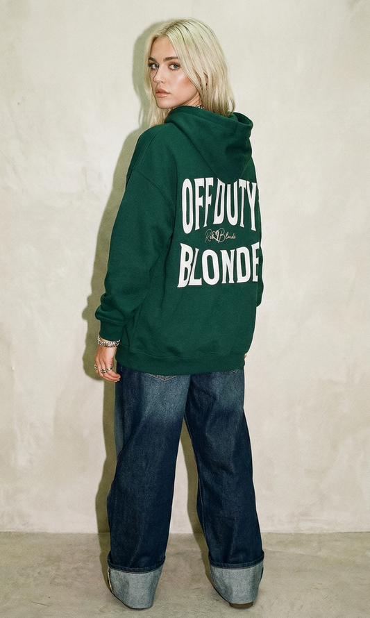 model wears a Forest green hoodie, back view, with large white ‘OFF DUTY BLONDE’ Brookfield text print and small RedBlonde  signature logo beneath.