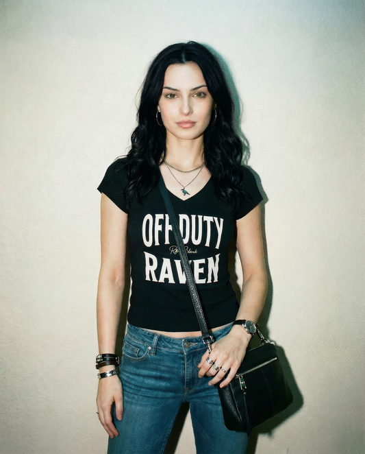 model wears a black fitted V-neck T-shirt with black ‘OFF DUTY RAVEN’ Brookfield text front print, RedBlonde logo detail, and RedBlonde neck label