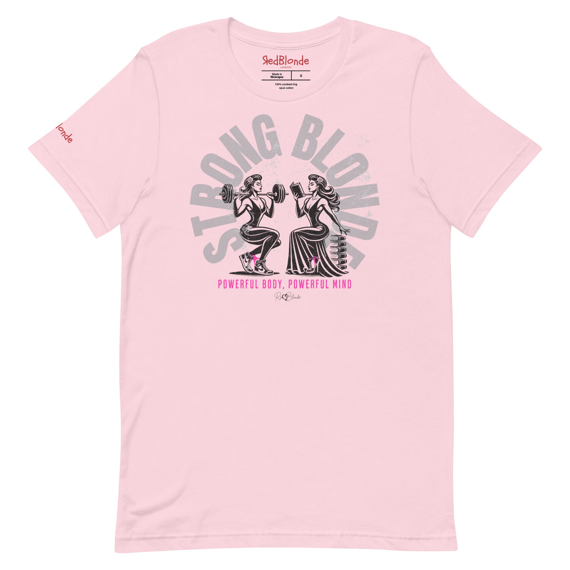 A pale pink relaxed-fit crew neck t-shirt featuring a graphic of two women: one holding a barbell on her shoulders, the other reading a book on a pile of books. The words ‘STRONG BLONDE’ are arced over the women in pale grey, while ‘Powerful Body, Powerful Mind’ is in bright pink underneath. The t-shirt is signed off RedBlonde with a heart. Branded RedBlonde in red on inside neck and right sleeve