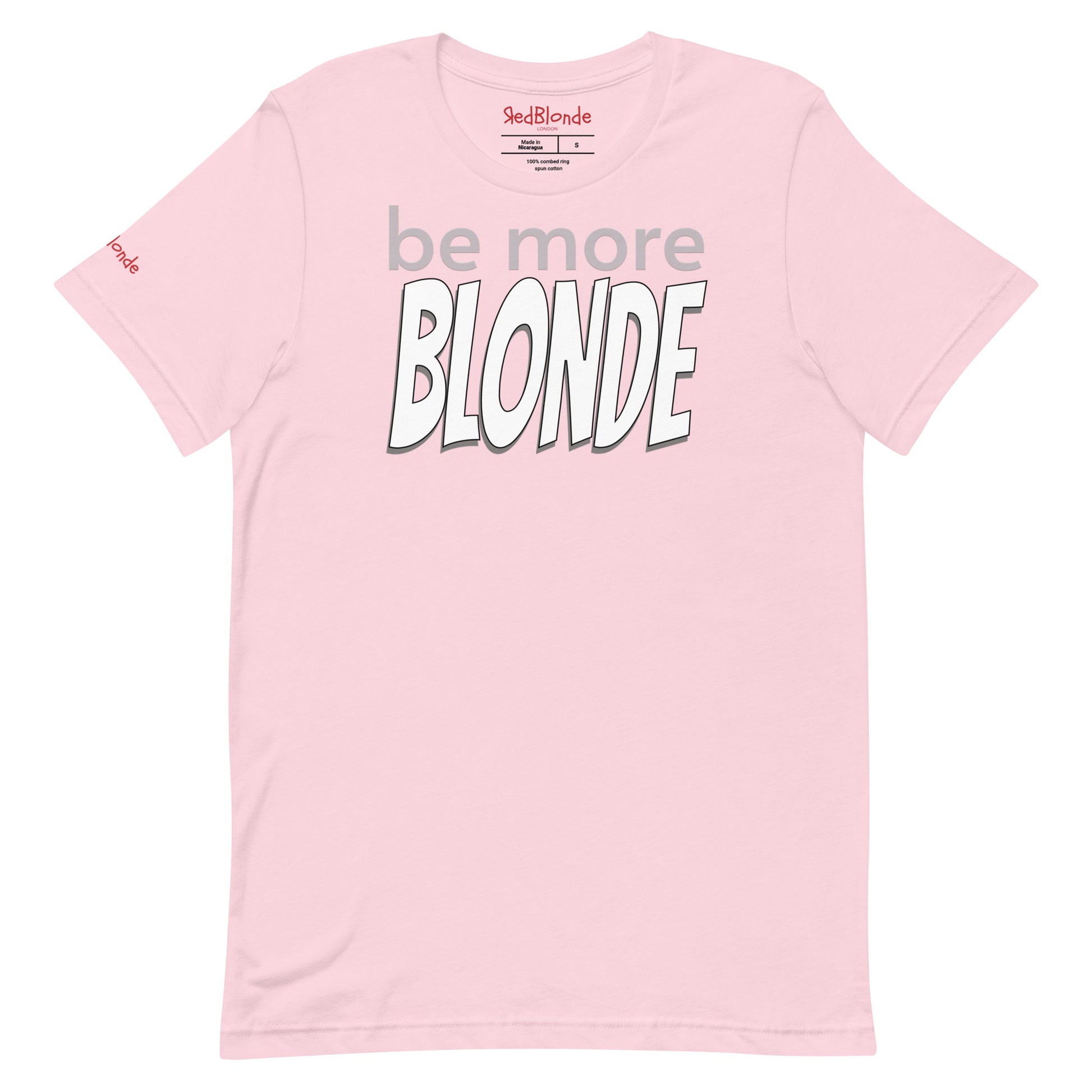 Flatlay of a pale pink unisex relaxed fit graphic t-shirt with the slogan 'be more Blonde' in grey and black outlined white 'bangers' text. Branded RedBlonde in red in inside neck and right sleeve